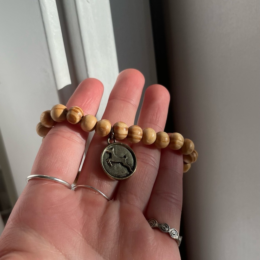 Wooden bead bracelet with dog charm